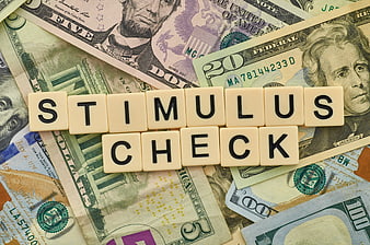 Stimulus Check Scrabble Tiles on US Dollar Bills