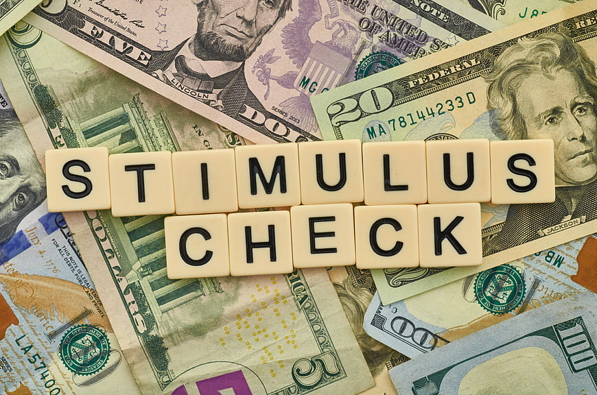 Stimulus Check Scrabble Tiles on US Dollar Bills