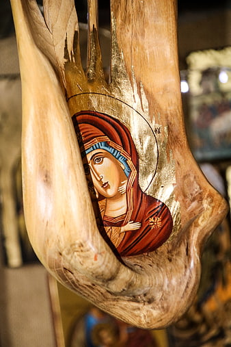 Hand-painted Orthodox icon on natural driftwood