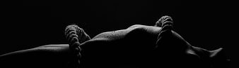 Black and white artistic silhouette of a woman with rope