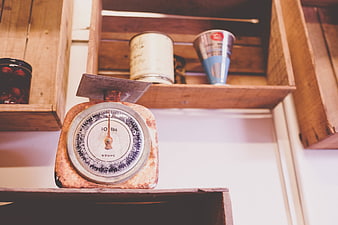 Vintage Rusty Kitchen Scale on Wooden Shelf