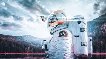 Astronaut with butterfly on helmet in misty forest landscape