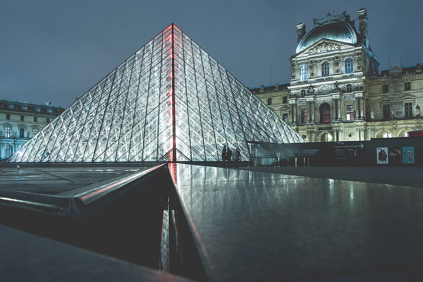Louvre Pyramid at Night with Reflections in Paris