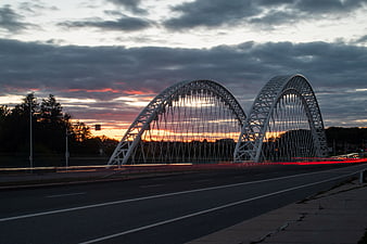 White Arch Bridge at Sunset with Long Exposure Traffic Trails