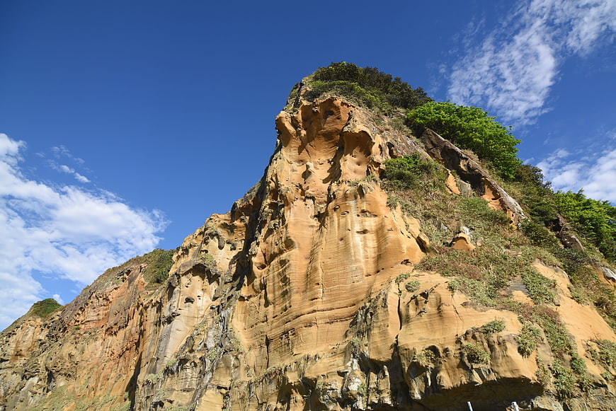 Chiefs Rock coastal cliff landscape with blue sky