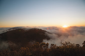Sunrise Over Mountain Peaks With Sea of Fog