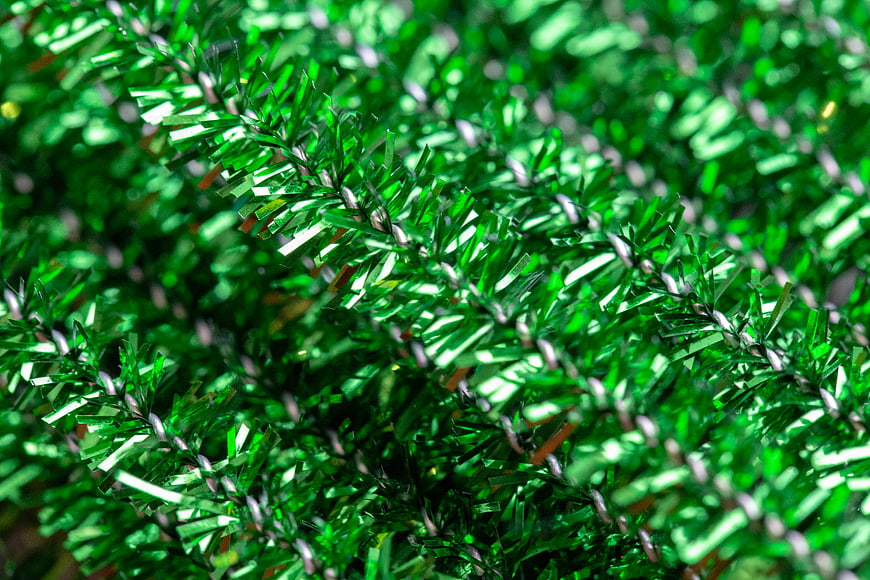 Close-up of shiny green tinsel texture background
