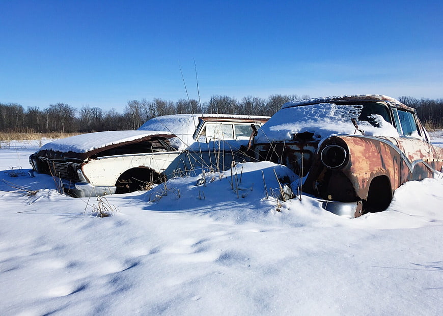 Abandoned Rusty Vintage Cars Buried in Snow