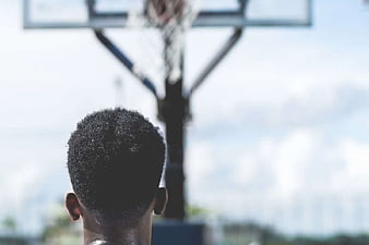 Back View of Basketball Player Facing Hoop