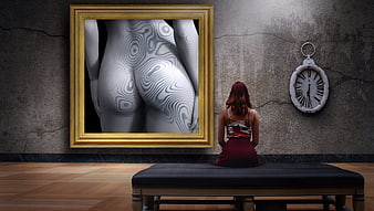 Woman sitting on bench viewing surreal body art in gold frame