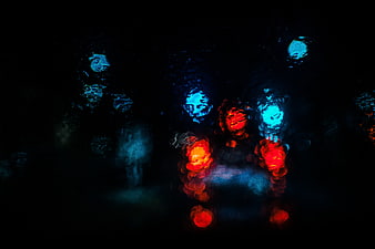 Abstract Bokeh Lights on Rainy Window at Night