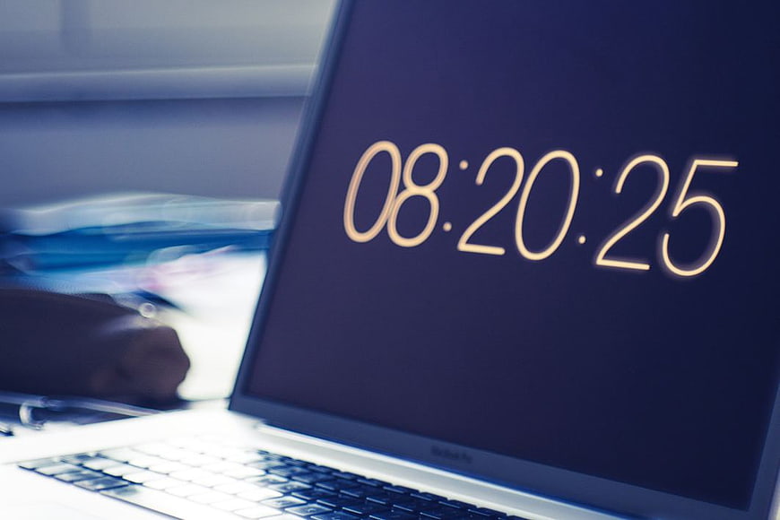 Laptop Screen Displaying Digital Clock Time