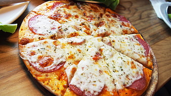 Freshly Baked Pepperoni Pizza on Wooden Board