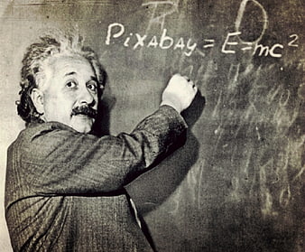 Vintage photo of Albert Einstein writing Pixabay formula on chalkboard