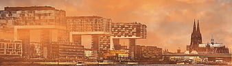 Cologne skyline with modern architecture and cathedral at sunset