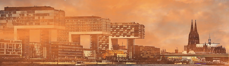 Cologne skyline with modern architecture and cathedral at sunset