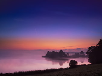 Misty Lake Sunrise Landscape with Purple and Orange Sky