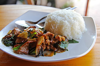 Thai Basil Pork Stir Fry with White Rice on Plate