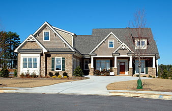 Suburban Two-Story House With Brick And Shingle Facade