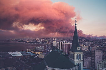 Dramatic Pink Clouds Over Coastal City Skyline