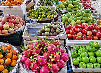 Colorful Vietnamese Fruit Market Display With Dragon Fruit And Apples