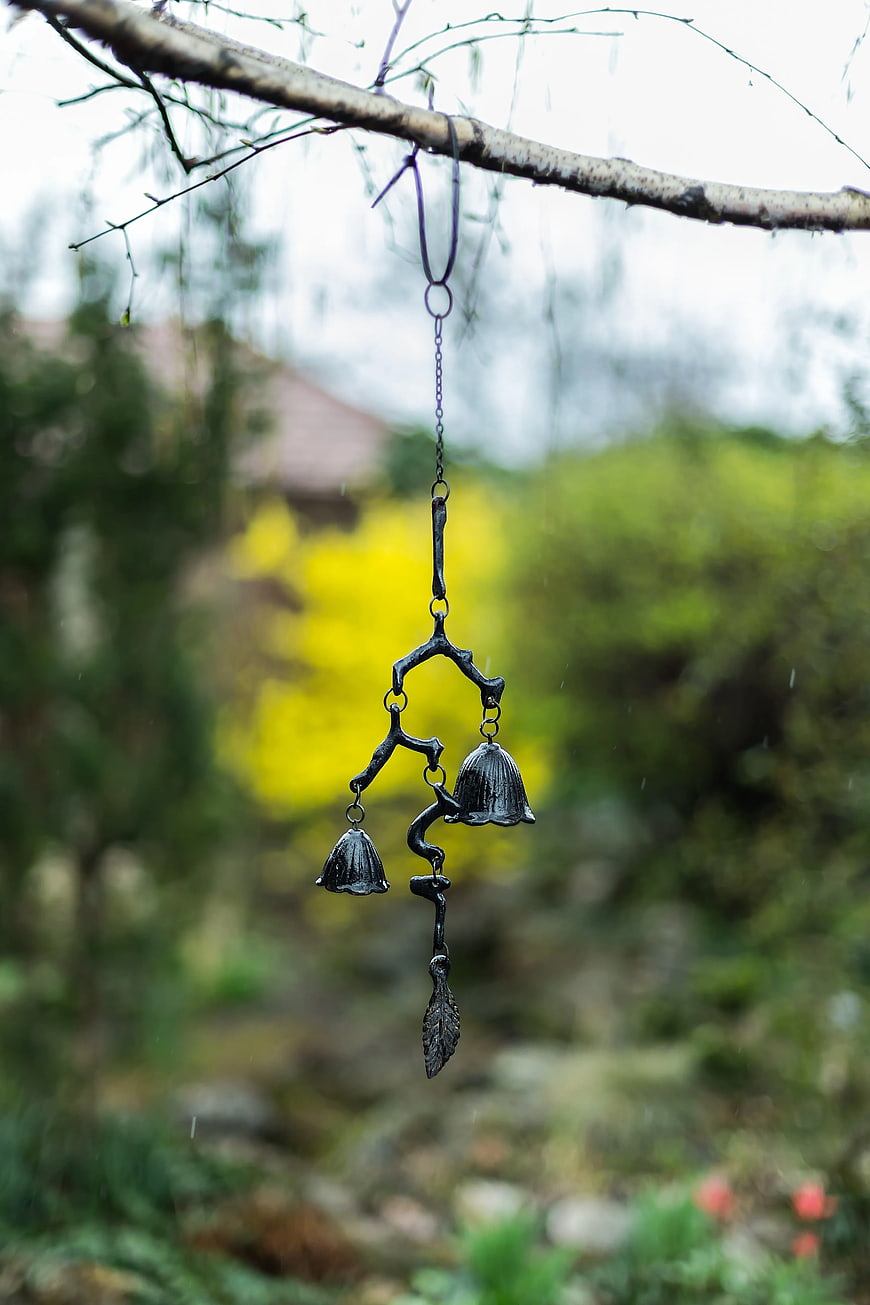 Black Metal Wind Chimes Hanging on Tree Branch