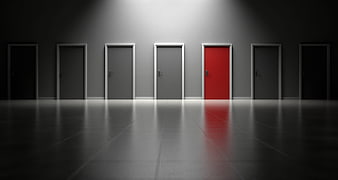 Conceptual 3D Render of Red Door Among Gray Doors in Dark Hallway