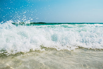 Dynamic Ocean Wave Splash on Turquoise Beach