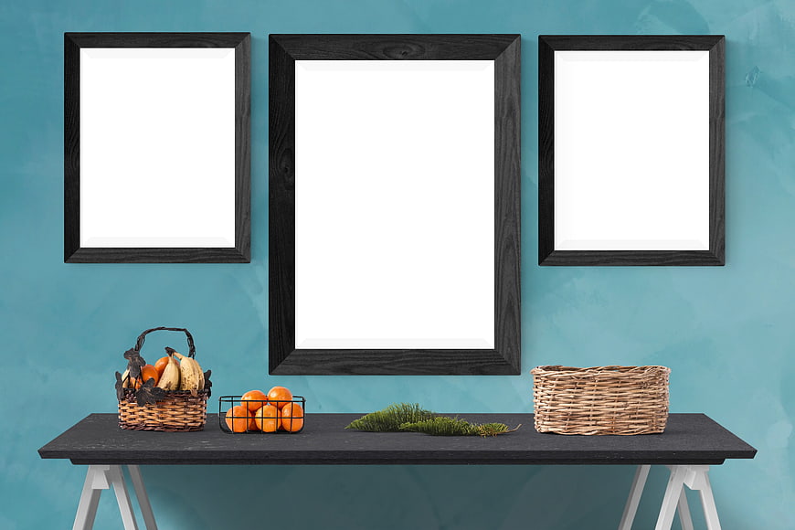 Interior Mockup with Three Black Frames on Teal Wall
