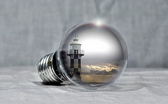 Lighthouse inside lightbulb concept for ideas and energy