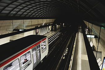 Subway train arriving at underground station platform