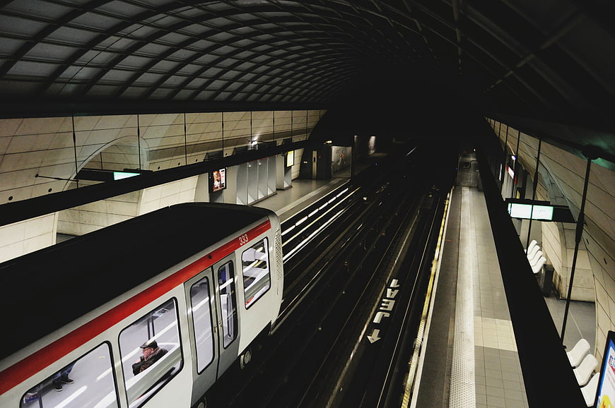 Subway train arriving at underground station platform