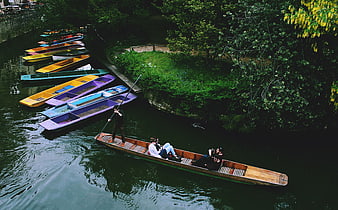 High angle view of punting on a river with colorful boats