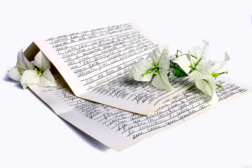 Handwritten Love Letter With White Flowers On White Background