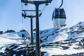 Gondola Cable Car on Snowy Mountain Slope
