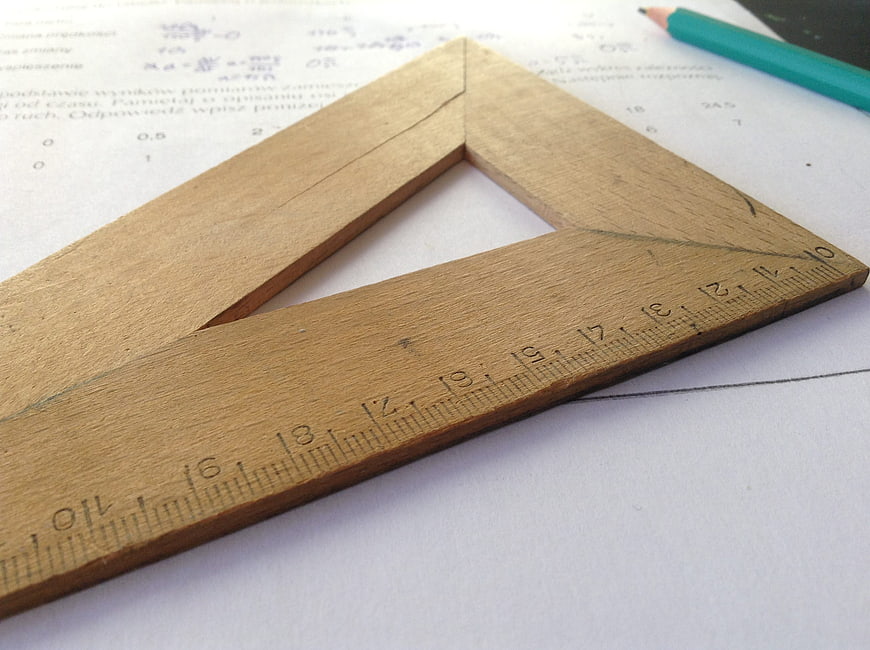 Wooden Set Square on Math Worksheet with Pencil