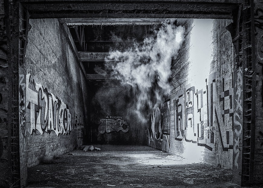Atmospheric Black and White Abandoned Tunnel with Graffiti