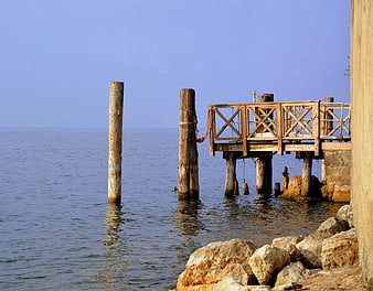 Wooden Pier on Lake Garda with Calm Blue Water