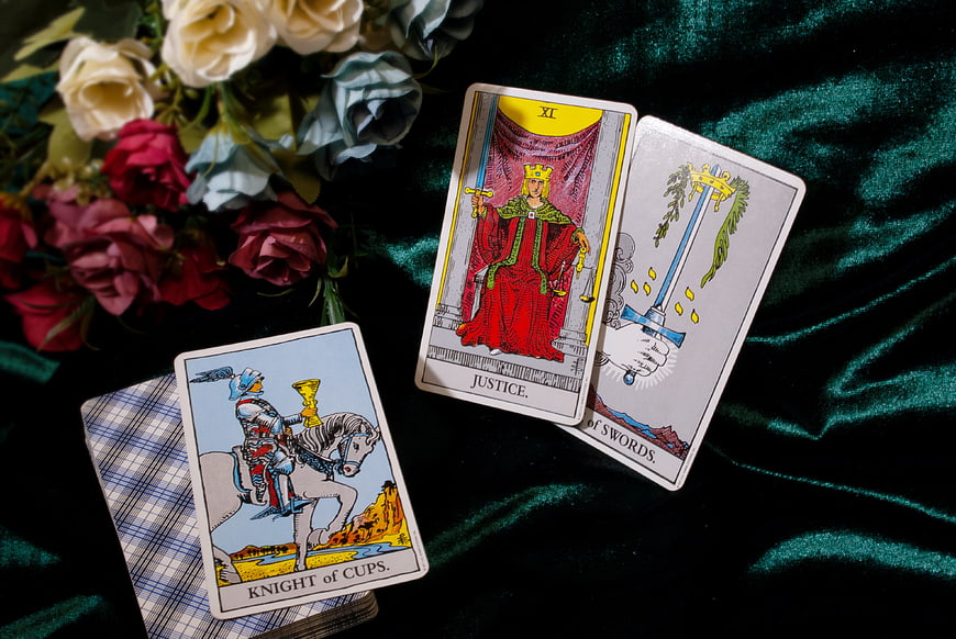 Tarot Card Reading Setup With Roses And Green Velvet