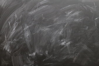 Textured blackboard background with chalk smears and scratches