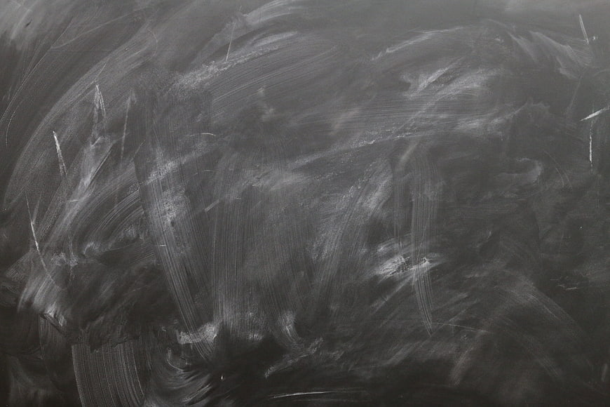 Textured blackboard background with chalk smears and scratches