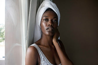 Portrait of Black Woman with Towel on Head by Window