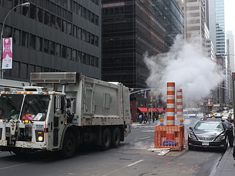 NYC Garbage Truck and Steam Vent on City Street