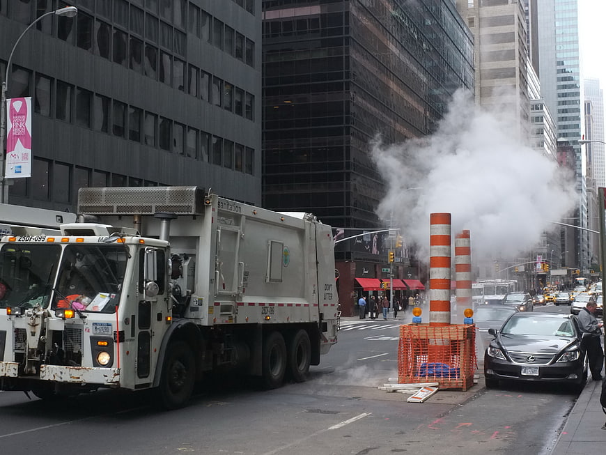 NYC Garbage Truck and Steam Vent on City Street