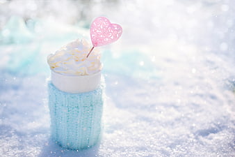 Hot Chocolate with Whipped Cream and Heart in Snow