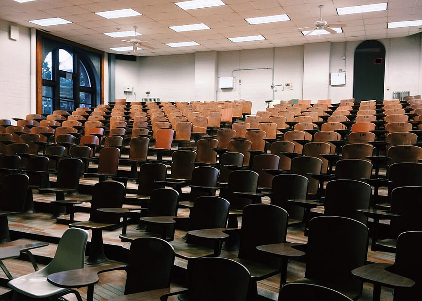 Empty University Lecture Hall with Wooden Desks