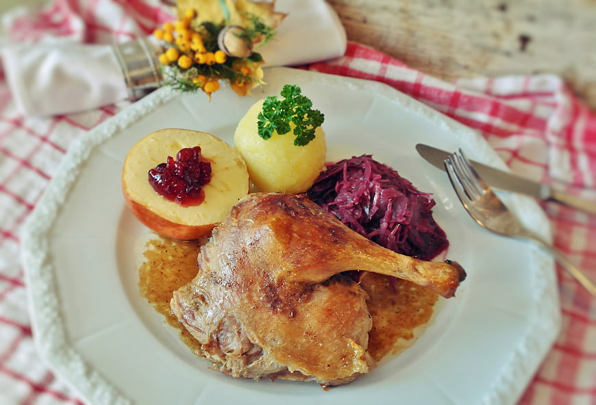 Traditional Roast Duck Dinner with Red Cabbage and Potato Dumplings