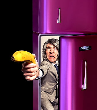 Man in Suit Emerging from Purple Refrigerator Holding Banana