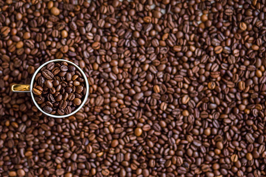 Top View of Coffee Cup Filled with Roasted Beans