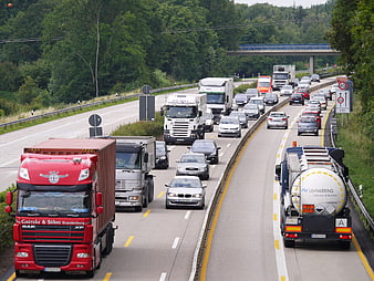 Heavy traffic on highway with trucks and cars